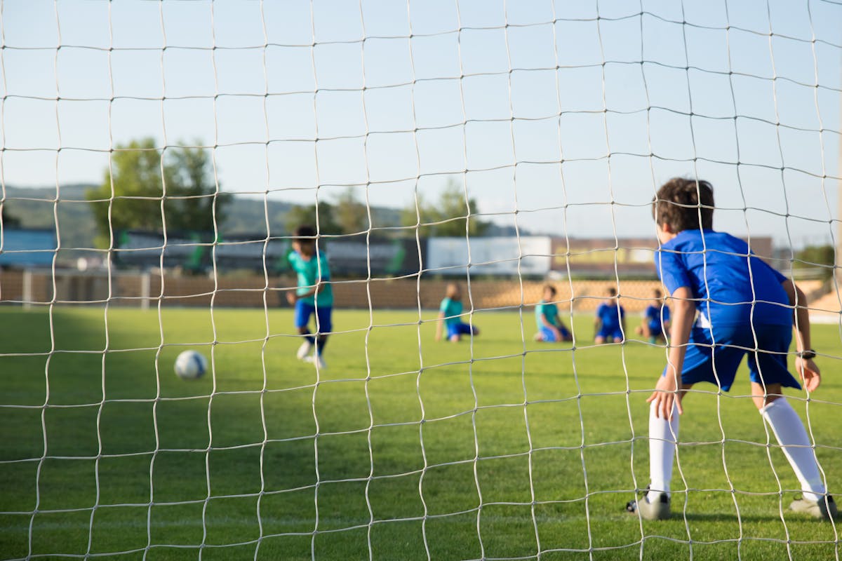 Kids playing on a sunny grass field